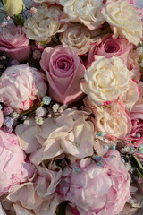 Beautiful fashionable bouquet in soft pink tones of roses, peonies and hydrangeas. View from above
