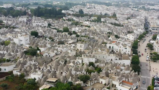 The traditional Trulli houses in Alberobello city, Apulia, Italy. Cityscape over the traditional roofs of the Trulli, original and old houses of this region, Apulia, Alberobello, Puglia, Italy.