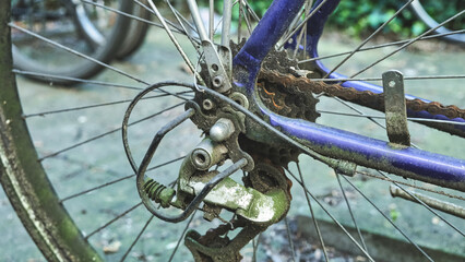 Close up of dirty old rear derailleur and bike cassette. Bicycle repair and cleaning.