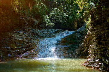 beautiful waterfalls in the mountains in summer