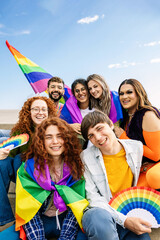 Portrait group of young gay people sitting together celebrating LGBT pride parade day festival....
