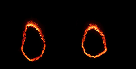 burning paper, glowing edge of paper on a black background