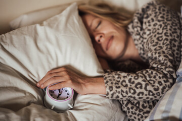 circadian rhythm, sleeping woman and alarm clock.