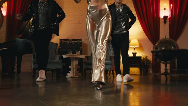 Men and women dancing passionately, expressing their feelings in dance slow motion 4K. Elements of modern funk jazz choreography performed by young couples of dancers in classy retro studio background
