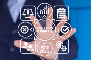 Man using virtual touch screen represents inscription: ARE YOU ELIGIBLE? Concept of business,...