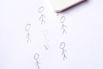 Cancellation culture concept. The drawn figure of a person is erased with an eraser.