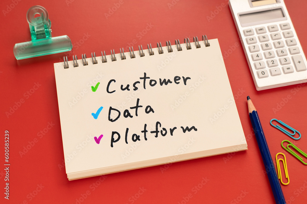 Poster there is notebook with the word customer data platform.it is as an eye-catching image.