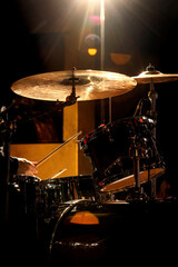 Obraz na płótnie Canvas Percussionist performing on rock drum set with drumsticks.