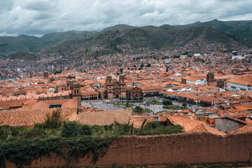Fototapeta premium Panoramic view of the entire Imperial City of Cuzco, the navel of the world, traditional orange roofs