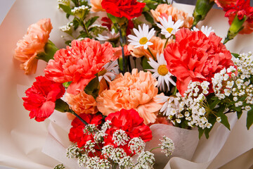 bouquet of carnations and daisies on a white background