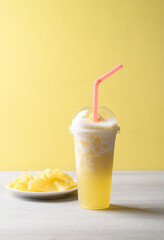 Pineapple smoothie with sliced pineapple fruit, Tropical summer drink
