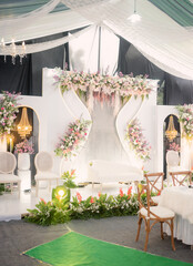 wedding backdrop display, asian wedding decoration design with lots of flowers and decorative lights