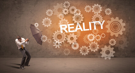 Obraz premium Businessman defending with umbrella concept