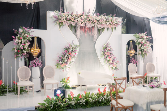 wedding backdrop display, asian wedding decoration design with lots of flowers and decorative lights