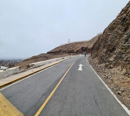road uphill to the Morro Solar mountain, next to Pacific Ocean in Lima, Peru