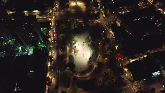Aerial Panoramic 360 View Above Bustamante Park at Night Barrio Italia Santiago, Chile Historical Neighborhood, Roads with Car Traffic