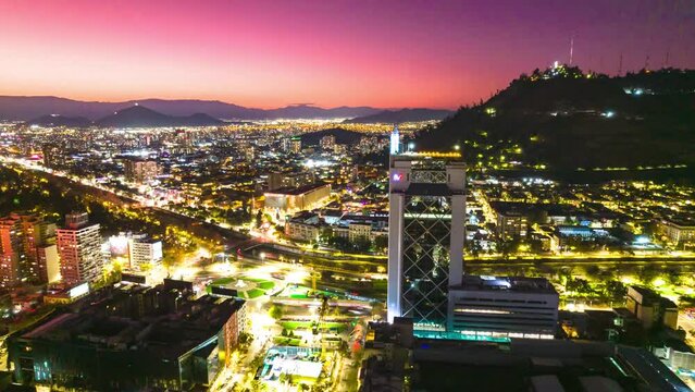 Aerial Hyperlapse Drone Fly Above Baquedano Santiago Chile at Sunset Nighttime Street Network of Latin American Vibrant Capital, Andean Cordillera Pink Background
