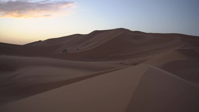 san dunes desert with colourful sunrise sand patterns with light contrast in Morocco africa 
