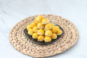 nastar cookies, pineapple tarts or nanas tart are small, bite-size pastries