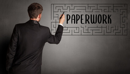 businessman drawing maze concept