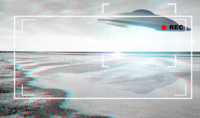UFO, alien and viewfinder on a camcorder screen with a spaceship flying in the sky over area 51....