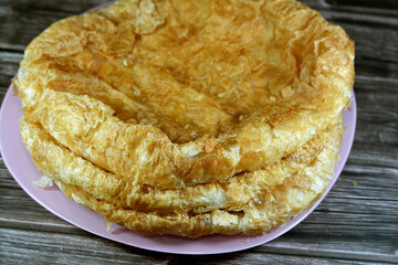 Egyptian Feteer meshaltet, layers upon layers of pastry dough with loads of ghee or butter in...