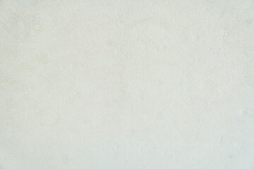 Old cement wall painted white with texture and seamless background, a template for your design with space to copy. High quality photo