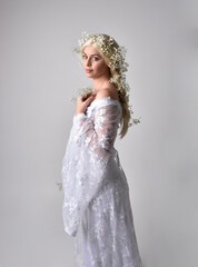 Close up portrait of beautiful women with long blonde hair, wearing white fantasy princess ball...