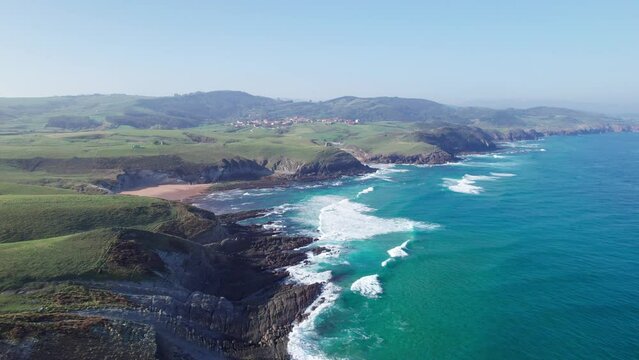 Full View on Playa de Tagle And Beautiful Green Hills Seen From The Bay Of Biscay