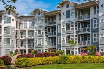 Facade of new residential townhouses. Apartment buildings in Canada. Modern complex of apartment...
