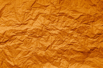 Natural abstract textured background of wrinkled orange paper.