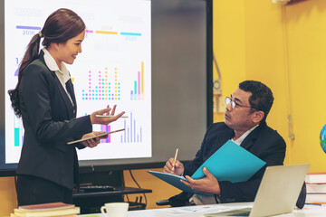 Businessman making presentation with his colleagues and business strategy digital layer effect at the office as concept.