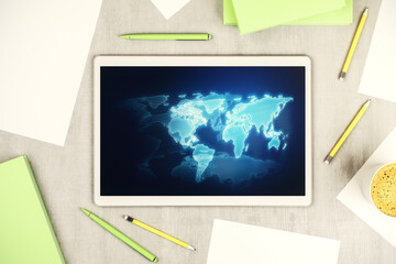 Top view of modern digital tablet display with abstract graphic world map, big data and networking concept. 3D Rendering