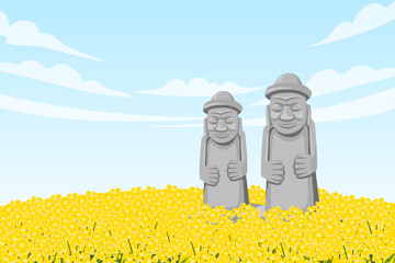 Two Dol hareubang in the middle of canola field