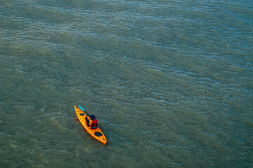 Kayaks in the lake. Tourists kayaking on the Bay, Aerial or drone view