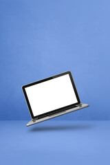Floating computer laptop isolated on blue. Vertical background