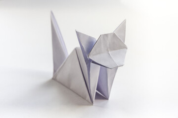 Paper cat origami isolated on a white background