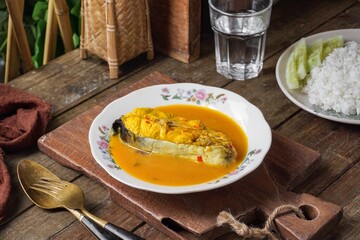 Silver catfish cooked with spicy coconut milk and fermented durian. A traditional Malay dish is known as Ikan Patin Masak Lemak Tempoyak