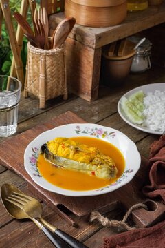 Silver catfish cooked with spicy coconut milk and fermented durian. A traditional Malay dish is known as Ikan Patin Masak Lemak Tempoyak