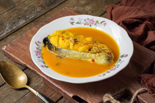 Silver catfish cooked with spicy coconut milk and fermented durian. A traditional Malay dish is known as Ikan Patin Masak Lemak Tempoyak