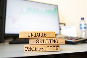 Wooden blocks with words 'Unique Selling Proposition'.