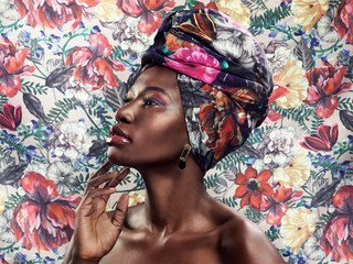 Black woman in African turban, fashion on flower background and beauty, makeup with floral aesthetic. Natural cosmetics, profile and female model in traditional head wrap with creativity and style - obrazy, fototapety, plakaty
