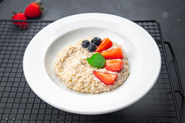 oatmeal porridge with berries tasty breakfast healthy meal food snack on the table copy space food background rustic top view