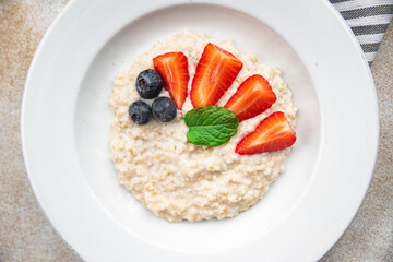 oatmeal porridge with berries tasty breakfast healthy meal food snack on the table copy space food background rustic top view