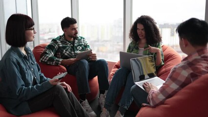 Joyful african american businesswoman being applauded by multicultural colleagues during regular meeting in modern office. Diverse group of managers holding annual formal briefing in coworking space.