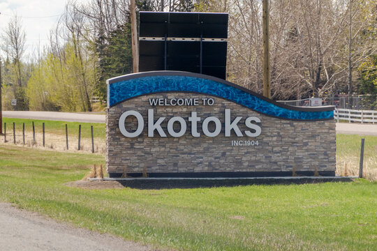 Calgary, Alberta, Canada. May 7, 2023. A welcome sign to the Okotoks town. A town in the Calgary Region of Alberta, Canada. It is on the Sheep River, approximately 18 km south of Calgary.