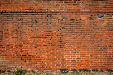 Red brick wall part of old castle masonry, close up