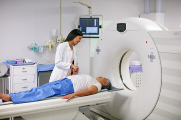 Doctor, mri and woman holding hands of patient in hospital before scanning in machine. Ct scan, comfort and medical professional with senior female person in radiology test for healthcare in clinic. - obrazy, fototapety, plakaty