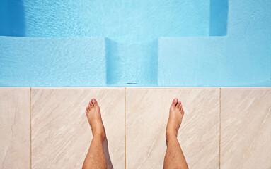 Water, feet and pov of man at a pool for swimming, leisure and summer, fun and relax. Barefoot,...
