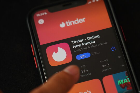 The Tinder application on the Iphone 11 Pro screen. Tinder is a location-based dating and social discovery service application.